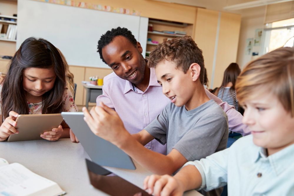 Male-Helping-Kids-Classroom-iPad-GettyImages-1045322966.jpg Male-Helping-Kids-Classroom-iPad-GettyImages-1045322966.jpg